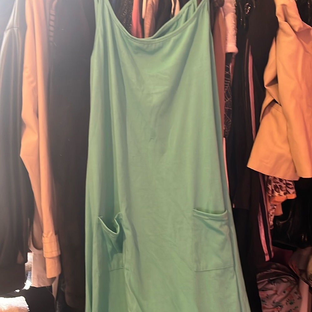 Medium sized turquoise summer jumper.